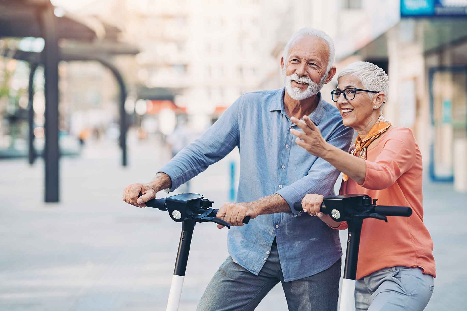 Couple riding scooters